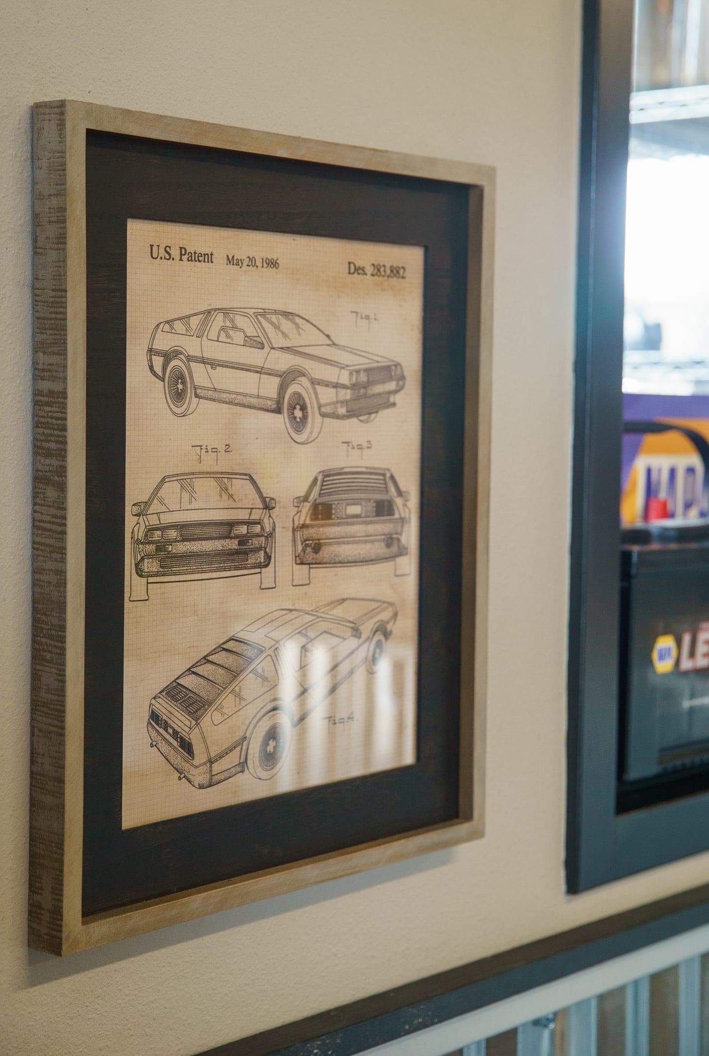 Framed classic-car artwork in the Warrenton lobby